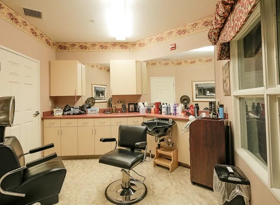 Interior of a hair salon with styling stations and products