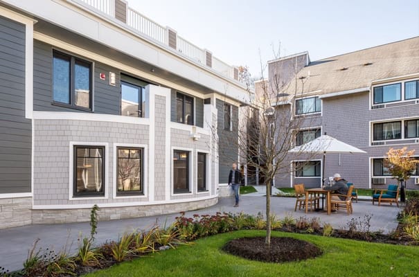 Residents enjoying the courtyard at NewBridge on the Charles