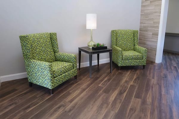 Interior seating area with patterned chairs and lamp