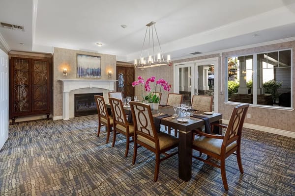 Elegant dining area with floral centerpiece and comfortable seating