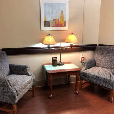 Cozy seating area with lamps and artwork