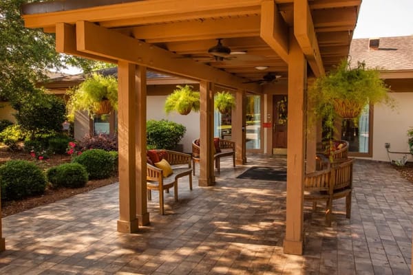 Covered outdoor seating area with plants