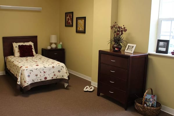 Cozy interior of a resident's room with bed and decorations