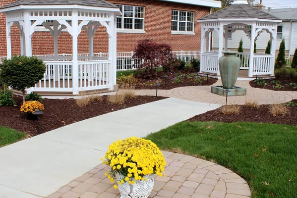 Gardens with white gazebos and flower planters