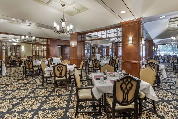 Elegant dining room with tables set for meals