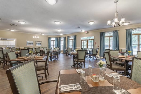 Dining room setup with tables and chairs
