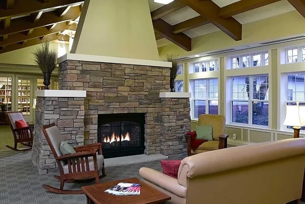 Cozy common area with a fireplace and seating