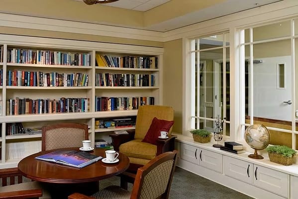Cozy reading nook with bookshelves and seating area