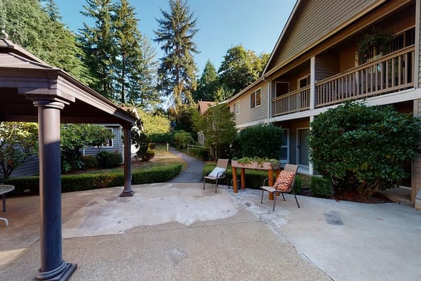 Outdoor seating area with pathways and greenery