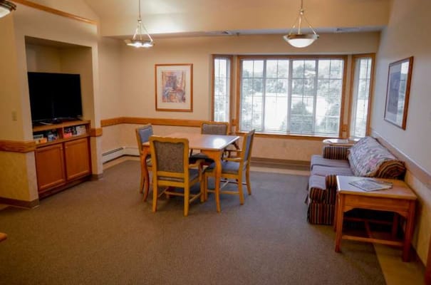 Interior common area with seating and dining table