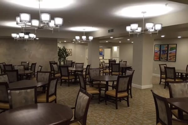 A spacious dining area with tables and chairs in Ralston Creek Neighborhood.