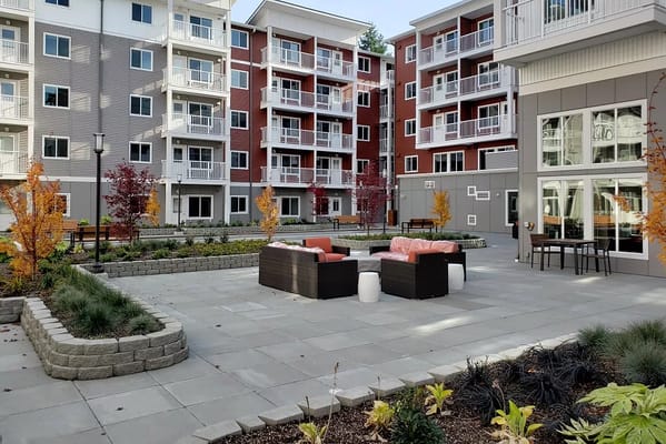 Outdoor seating area with colorful landscaping