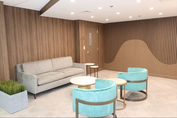 Modern lounge area with seating and lighting