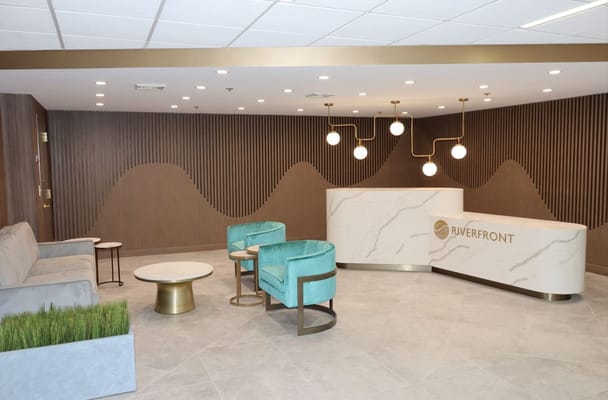 Modern lobby area with seating and reception desk