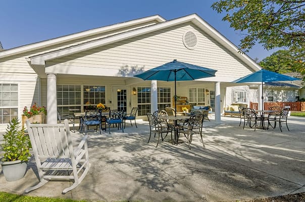 Patio area with tables and umbrellas for residents