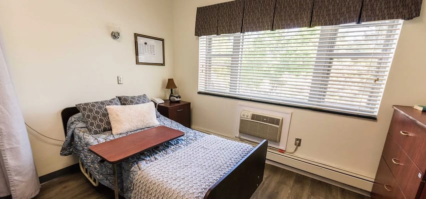 Cozy resident room with a bed and window