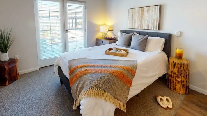 Cozy, well-decorated private bedroom with natural light