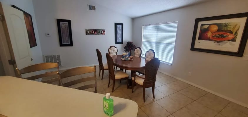 Interior dining area with a round table and chairs