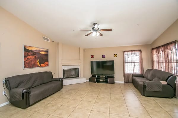 Bright common area with seating and television