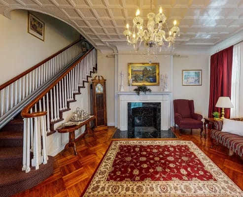 Interior common area with a staircase and chandelier