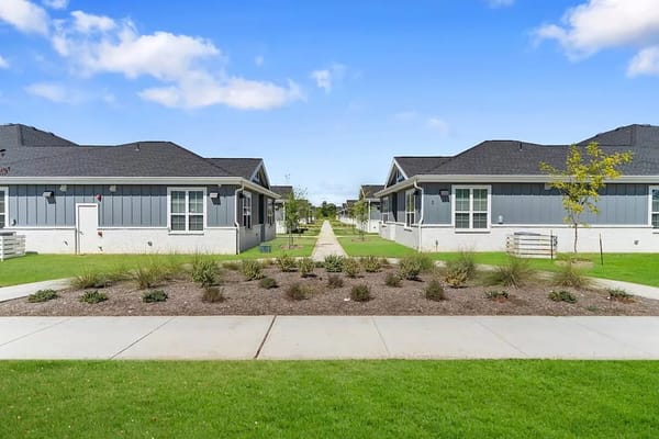 Gardens and pathways between senior living cottages