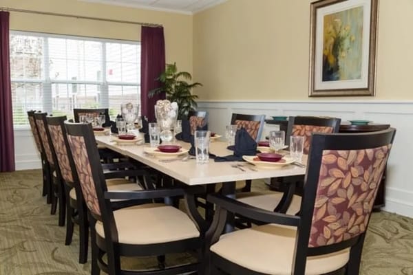 Well-set dining table in a bright and inviting room.