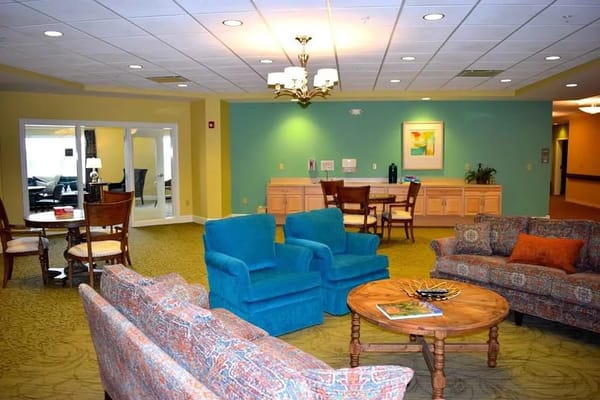 Cozy lounge area with colorful seating and dining space