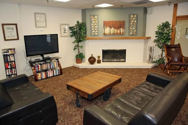 Cozy common area with seating and TV