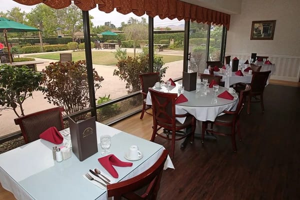 Dining room with tables set for a meal