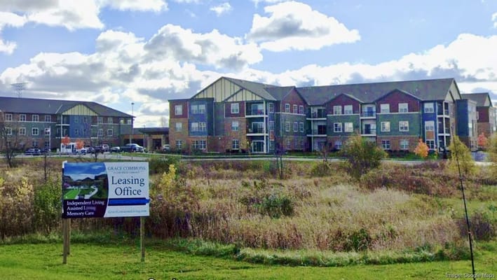 Exterior view of Grace Commons facility with leasing sign