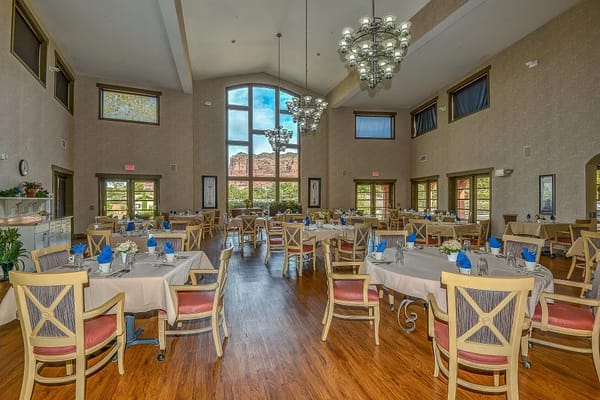 Bright dining room with tables set for a meal