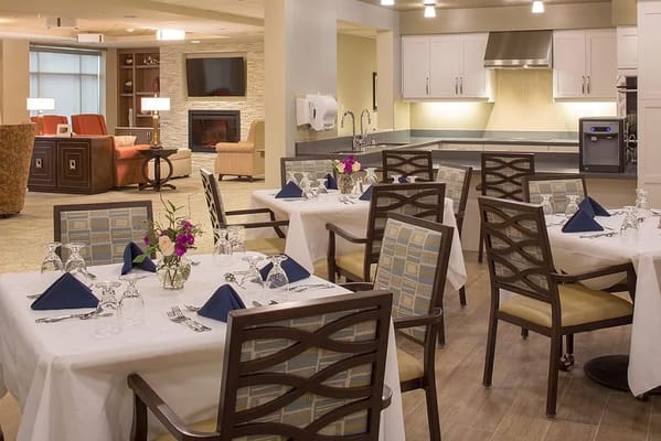 Elegant dining area with tables set for a meal in Silverado Alexandria.