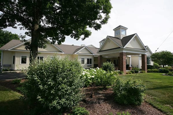 Exterior of Spring Village at Danbury surrounded by greenery
