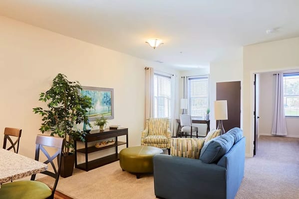 Bright and inviting living room with comfortable seating and natural light