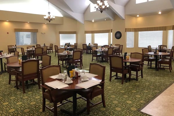Spacious dining room with empty tables and chairs