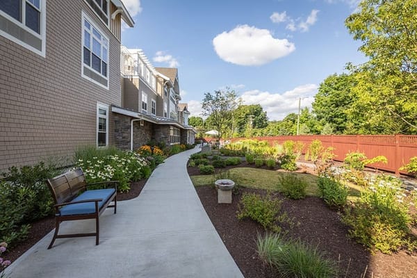 Pathway through landscaped garden at Sunrise of Wilton.