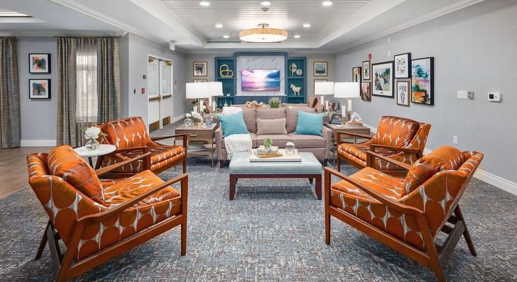 Bright and inviting common area with colorful seating