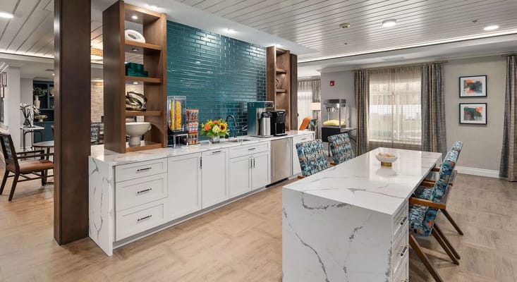 Interior common area with seating and kitchen amenities