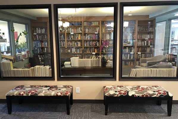 Library view through windows with benches in front.