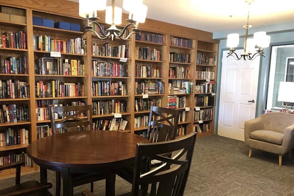 Cozy library with bookshelves and reading space