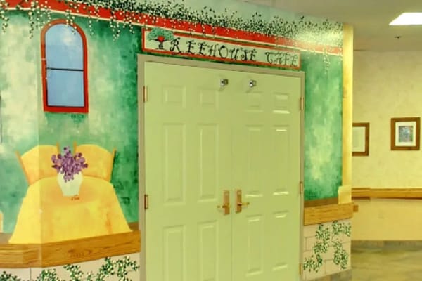 Entrance doors to the Treehouse Café with a decorative mural