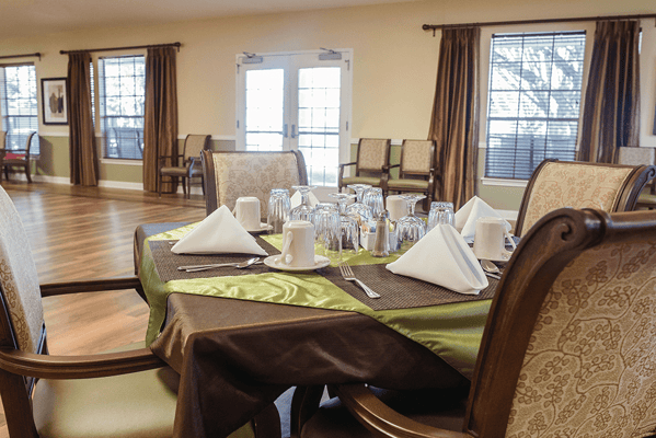 Dining area set for a meal with tableware and decorations