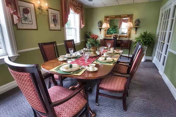Elegant dining room set up with table and chairs