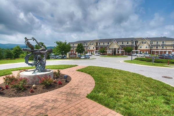 Sculpture and entrance view of Pheasant Ridge Nursing and Rehab Center in Roanoke, VA