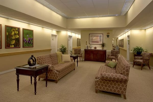 Interior lounge with seating and artwork at The Atrium at Rocky Hill