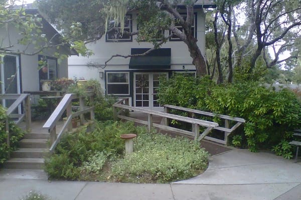 Exterior view of the facility with landscaped pathways