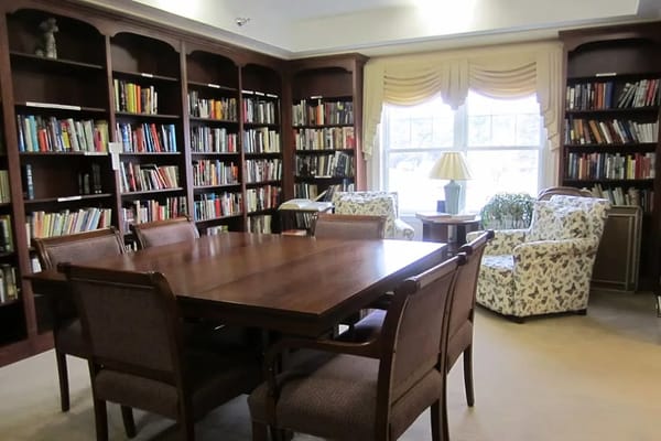 Cozy library with bookshelves and seating