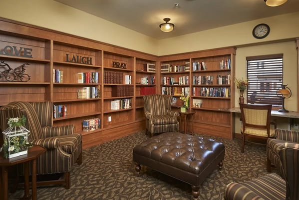 Cozy reading nook with bookshelves and seating
