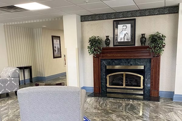 Interior view of a cozy lobby with a fireplace