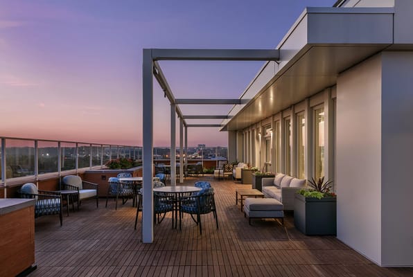 Rooftop outdoor space with seating and plants